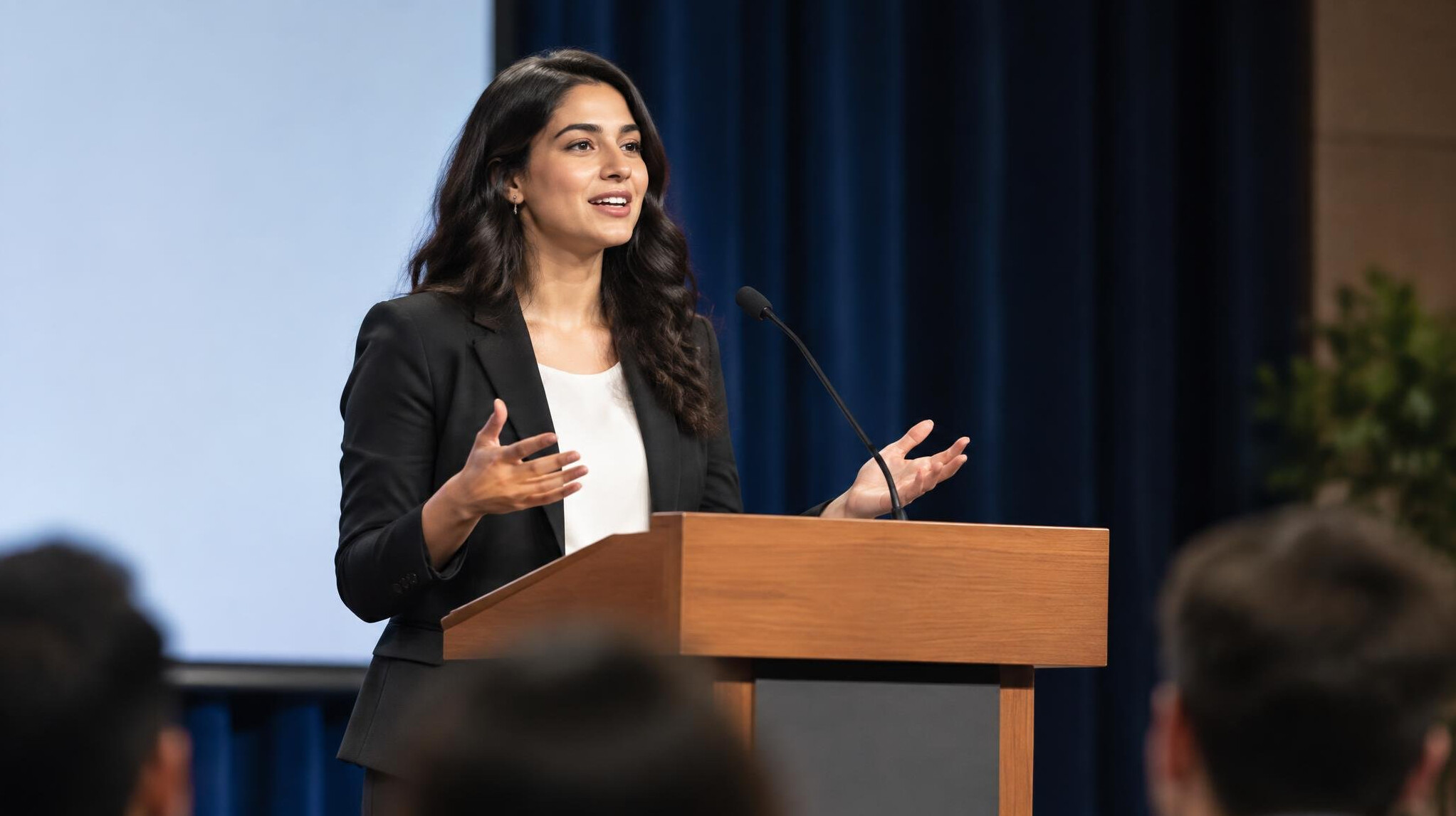 person giving speech on stage